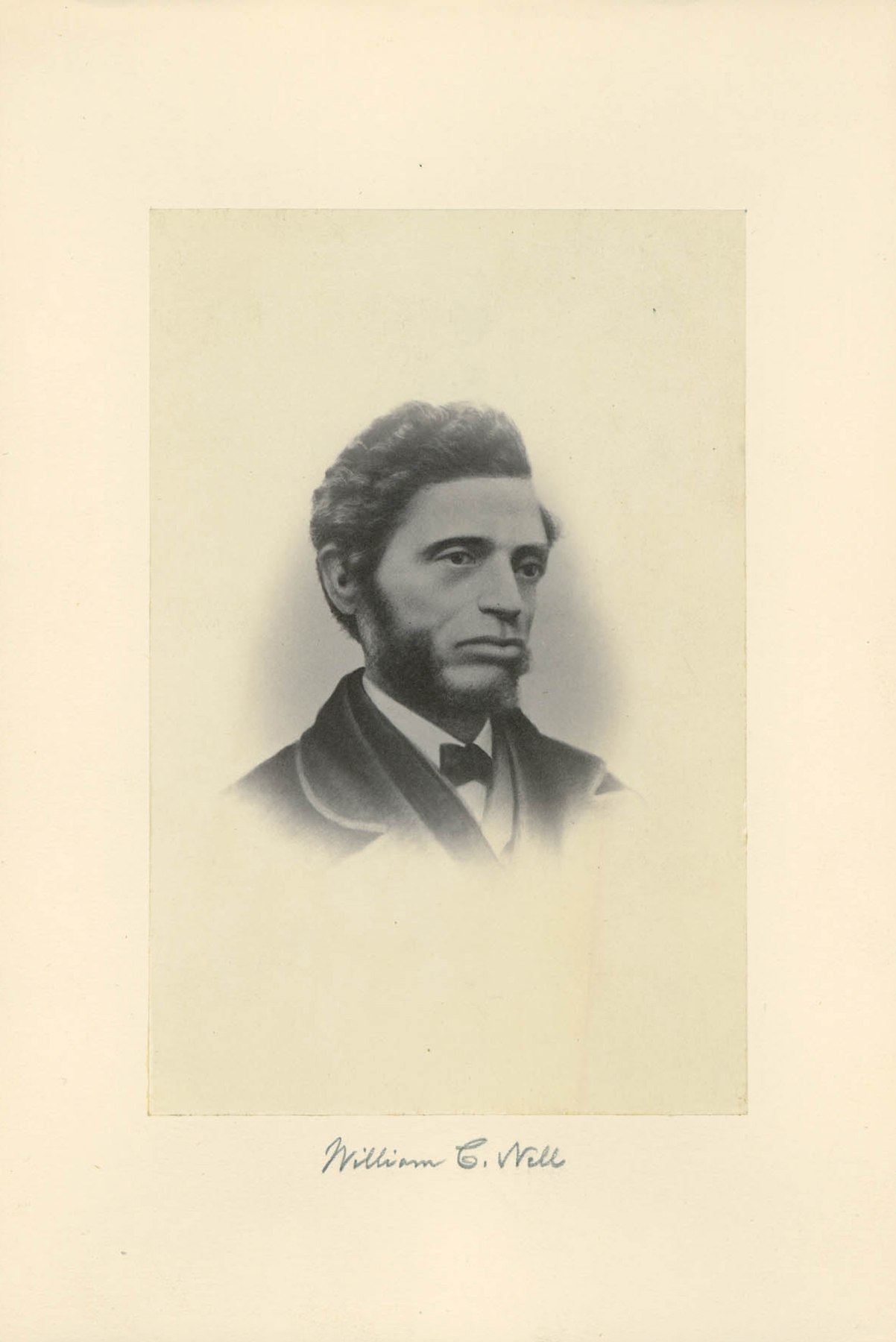black-and-white profile photograph of a man with a bear waring a jacket and tie. photo is labeled 'William C Nell' in pencil.