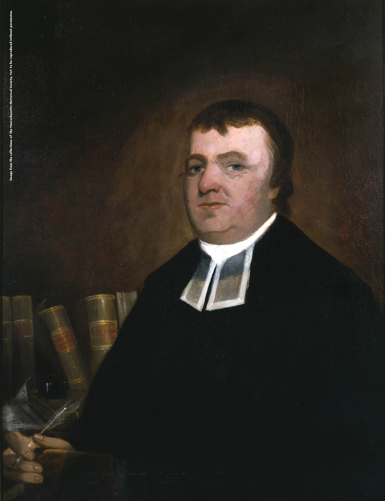 portrait of a white man wearing a long black coat with a white collar holding a quill with books on a shelf in the background