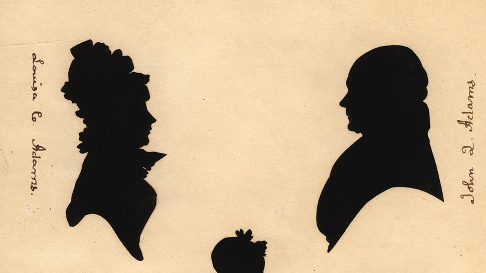 profile silhouette busts of a woman on the left and a man on the right facing each other. Vertical handwriting labels her as Louisa C. Adams and him as John Q Adams. The silhouette head of a child can be seen below and between them. 