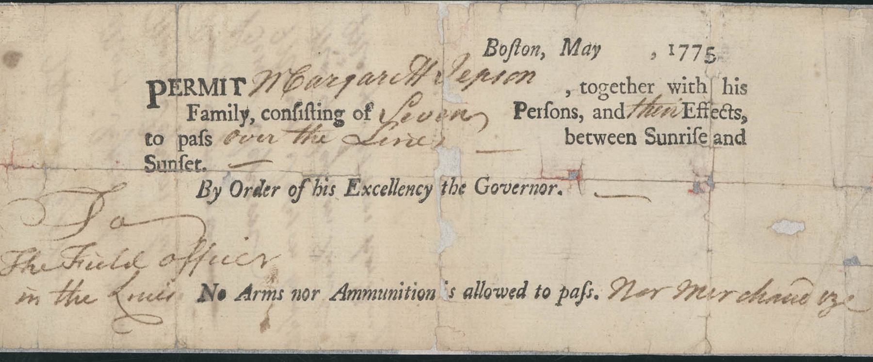 A printed slip of paper; a permit with the personal details of the holder filled in in cursive handwriting